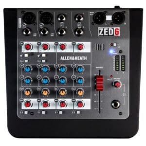 Audio mixer with multiple knobs and inputs.