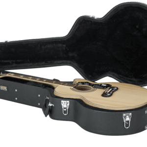 Acoustic guitar in an open black case.