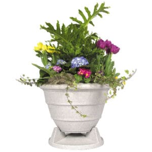 Colorful flowers in a large white planter.