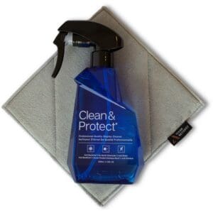 Cleaner spray bottle on microfiber cloth.