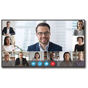 Video conference with smiling participants on screen.