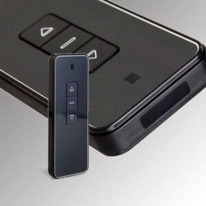 Black remote control with three buttons.