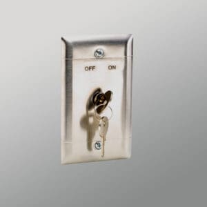 Key switch in metal wall plate.