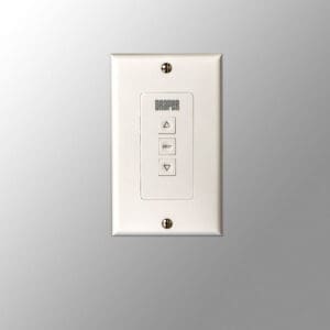 White wall switch with three buttons.