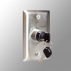 Key switch with keys on metal plate.