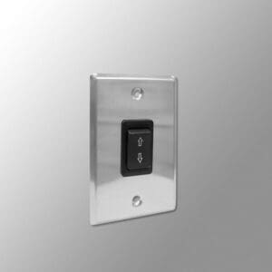 Metal switch plate with black up-down switch.