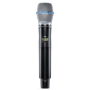 Wireless handheld microphone with silver mesh grille.