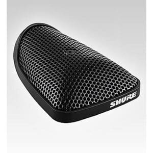 Black Shure boundary microphone on grey background.