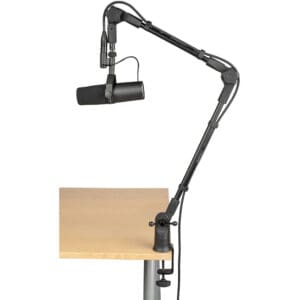 Microphone with adjustable arm on desk.