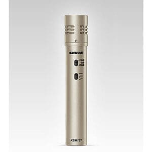 Silver Shure KSM137 microphone on gray background.