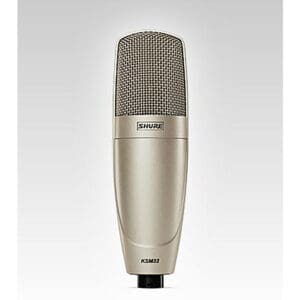 Shure KSM32 microphone on gradient background.