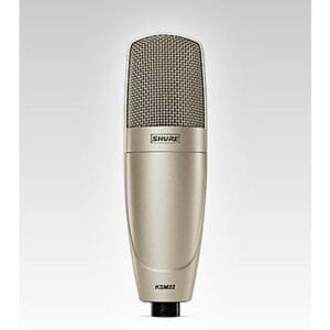 Silver Shure KSM32 microphone on white background.
