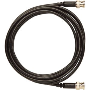 Black coaxial cable with connectors, coiled.