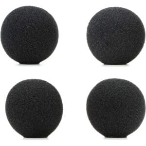 Four round black microphone foam covers.