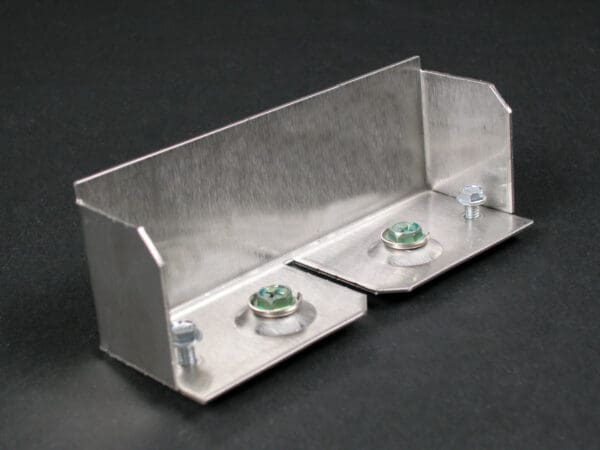 Aluminum bracket with screws and washers.