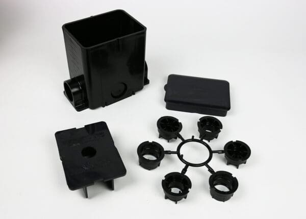 Black plastic electrical box and parts.
