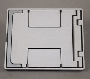 Here's an alt tag for the image: Square, white, foldable phone stand.