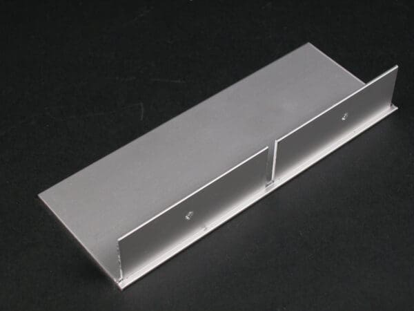 Aluminum plate with attached side pieces.