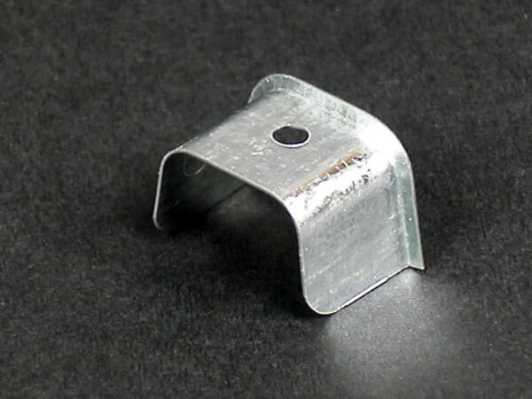 Metal U-shaped bracket with hole.
