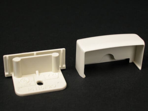 Off-white plastic blind end cap and base.