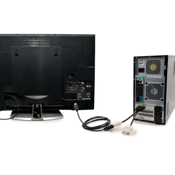 Computer connected to TV with cables.