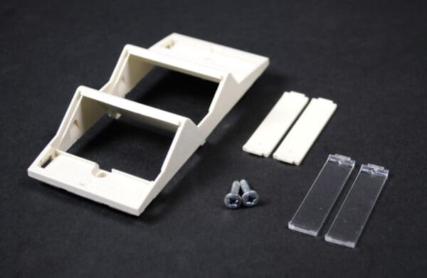 Triple wall plate kit with screws.