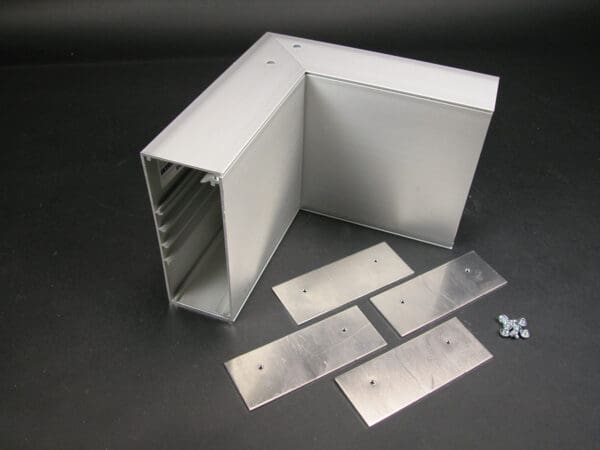 Aluminum corner box with mounting plates.