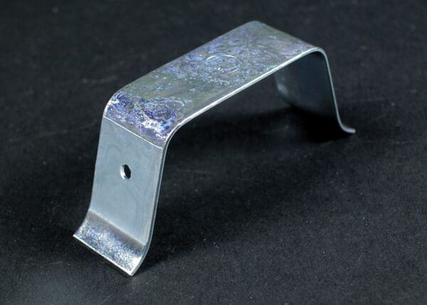 Metal bracket with single hole.