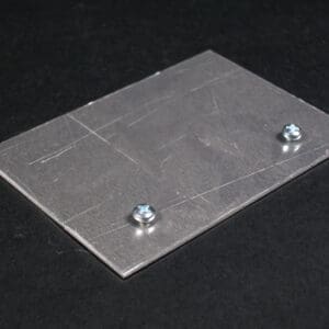 Here's an alt tag for the image: Metal plate with two screws.