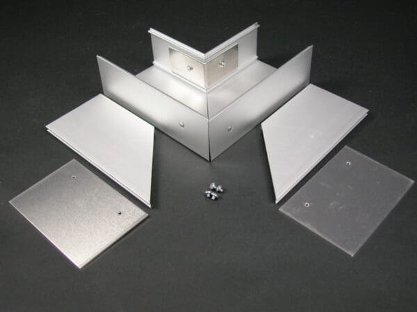 Aluminum corner bracket kit with screws.