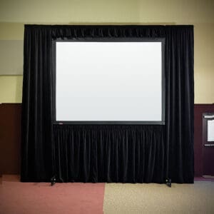 Projection screen with black curtains.