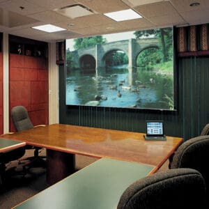 Conference room with projector and screen.