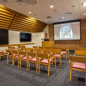 Conference room with projector and chairs.