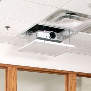 Ceiling-mounted projector in recessed panel.